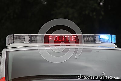 Police car in the netherlands with blue flash lights and text in roof console with STOP POLITIE Editorial Stock Photo