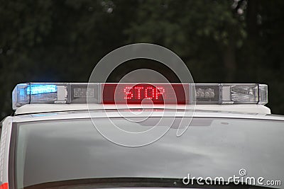 Police car in the netherlands with blue flash lights and text in roof console with STOP POLITIE Editorial Stock Photo