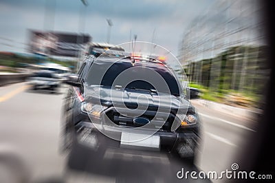 The police car zoomed quickly to open the siren, driving along t Stock Photo