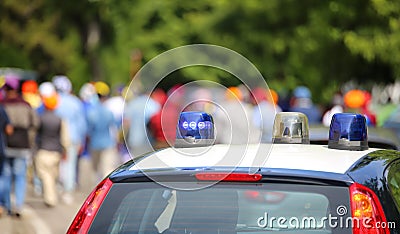 Police cars flashing sirens in the city Stock Photo