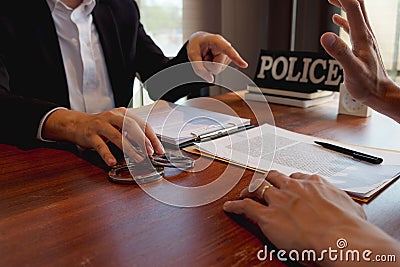 The police conducted an investigation. Inquiring about the violation of state laws Arrest the culprit offender Handcuffing Stock Photo
