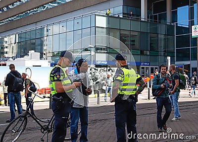 Police cordoning off area to stop people protesting on the streets against lockdown measures by the dutch government in the city Editorial Stock Photo