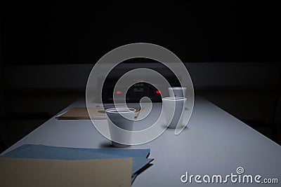 Police Custody Interview Room with Coffee Cups Stock Photo