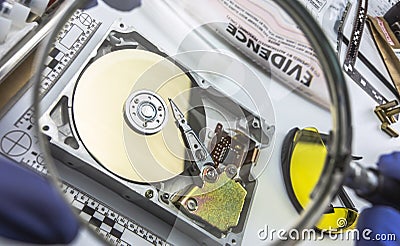 Police expert examines hard drive in search of evidence Stock Photo