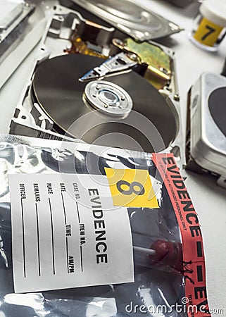 Police expert examines hard drive in search of evidence Stock Photo