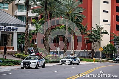 Police keeping the peace Brickell Miami FL during stay at home ordered quarantine Editorial Stock Photo