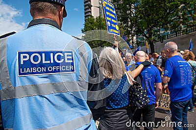 Police Liaison Officer at the March For Change protest demonstration. Editorial Stock Photo