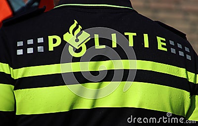 Police logo on the back of an agent on the uniform in the Netherlands Editorial Stock Photo