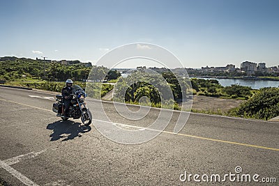 Police motorcycle driving Havana Editorial Stock Photo