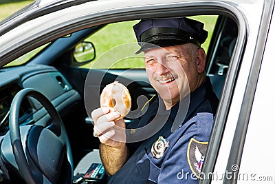 Police Officer and Doughnut Stock Photo