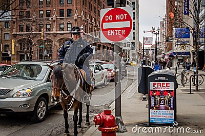 A police officer is on duty in downtown Chicago Editorial Stock Photo
