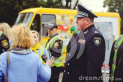 Police officer gives an interview Editorial Stock Photo