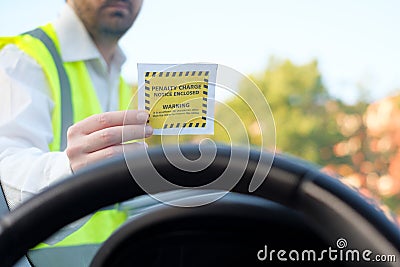 Police officer giving a fine for parking violation Stock Photo