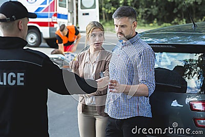 Police officer performing a sobriety test Stock Photo