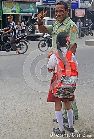 Police officer with small daughter is smiling and Editorial Stock Photo