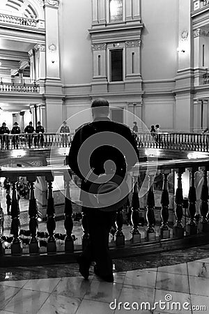 Police Officer Standing At Railing Editorial Stock Photo