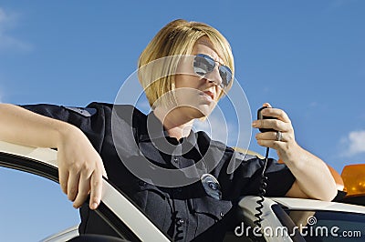 Police Officer Using Two-Way Radio Stock Photo