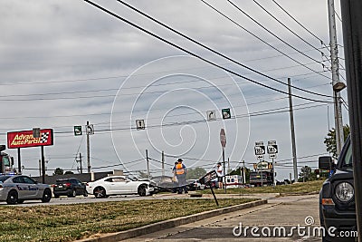 Police officer at a wreck white Camero Editorial Stock Photo