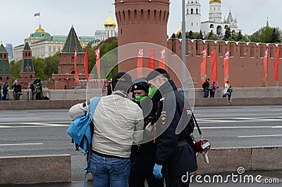 Police officers check pass from citizen on Moscow street during coronavirus pandemic Editorial Stock Photo