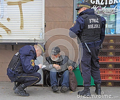 Police officers are checking some strange man Editorial Stock Photo