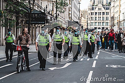 Police officers on duty at Save Our Children Protest against Children Trafficking Editorial Stock Photo