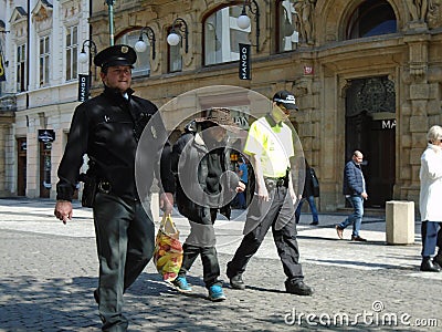 Police officers hold homeless cowboy Editorial Stock Photo