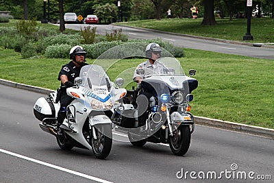 Police officers riding motorbikes Editorial Stock Photo