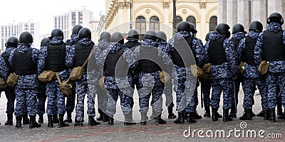 Police officers stand in a cordon on political rally in support of the arrested opposition leader Alexei Navalny Editorial Stock Photo