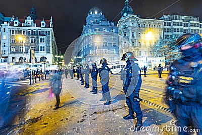 The police pays attention for not entering the streetcar rails due of drunken people at the silvester party in Prague Editorial Stock Photo