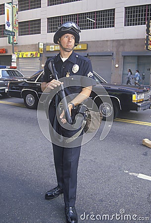 Police in riot gear holding weapon, downtown Los Angeles, California Editorial Stock Photo