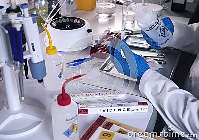 Police scientist prepares vial with distilled water in microcentrifuge, specialist investigates DNA from homicide case in crime Stock Photo
