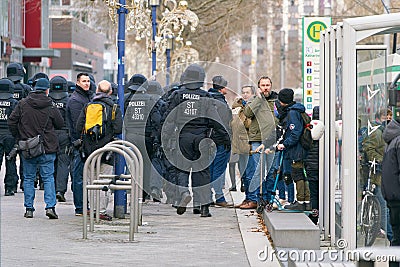 Police security forces during protests by opponents of the Corona measures and compulsory vaccination in Magdeburg Editorial Stock Photo