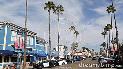 Police sheriff car. Palm trees on street, pacific coast tropical resort. Oceanside, California USA Editorial Stock Photo