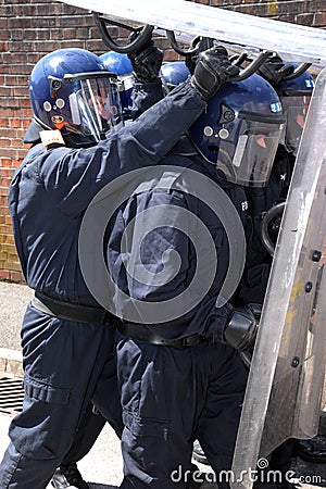 Police shield formation Editorial Stock Photo