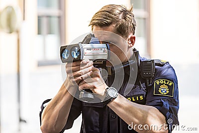Police with speed enforcement laser Editorial Stock Photo