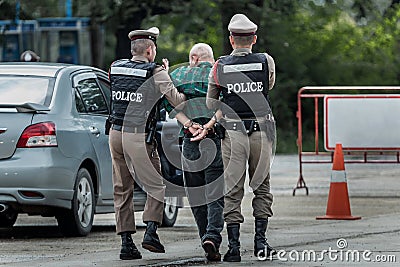 Police steel handcuffs,Police arrested,Police arrested the wrongdoer. Editorial Stock Photo