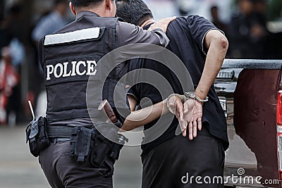 Police steel handcuffs,Police arrested,Professional police officer has to be very strong,Officer Arresting. Editorial Stock Photo