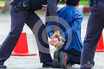 Police steel handcuffs,Police arrested,Professional police officer has to be very strong,Officer Arresting. Editorial Stock Photo