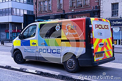 Police van decorated with LGBT plus rainbows, in Newcastle upon Tyne, UK. Editorial Stock Photo