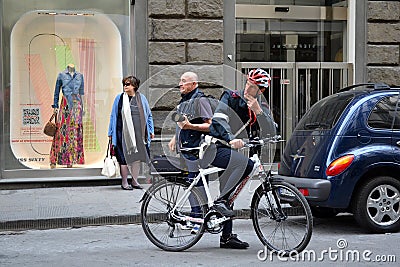 Policeman with bike Editorial Stock Photo