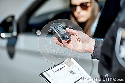 Policeman with alcotest device Stock Photo