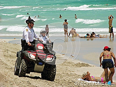 Policeman in quad-biking, the beaches of Miami patrol. Editorial Stock Photo