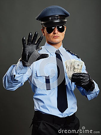 Policeman shows stop Stock Photo