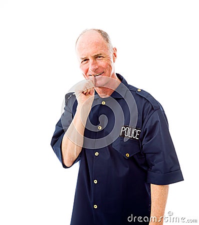 Policeman smiling with finger in mouth Stock Photo