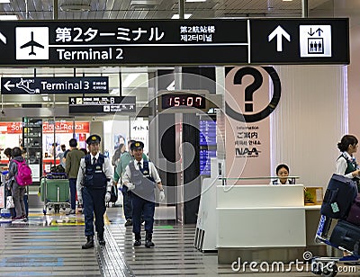Policemen at Narita Airport Editorial Stock Photo
