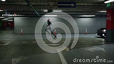 Policemen in patrol car chasing criminal. Male offender running from cops Stock Photo