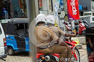 Policemen in uniform riding on a motorcycle Editorial Stock Photo