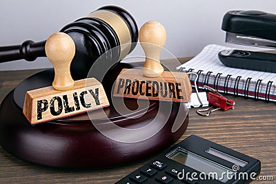 Policy and Procedure concept. Judge gavel and stationery Stock Photo