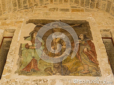 Crucifixion painting, Marchesale Arch, Polignano a Mare, Italy Stock Photo