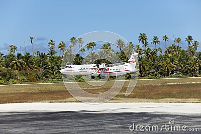 POLINESIA- JUNE 16: plane - ATR 72 Air Tahiti companies makes landing on the small tropical island Tikehau on june 16, 2011 Editorial Stock Photo